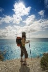 woman-hiking-and-looking-up-to-the-sky