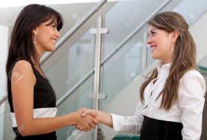 women shaking hands